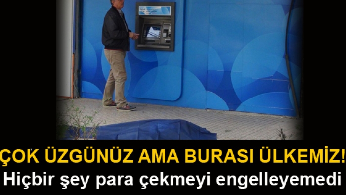 Yerde yatan cenazeye aldırmadan parasını çekti